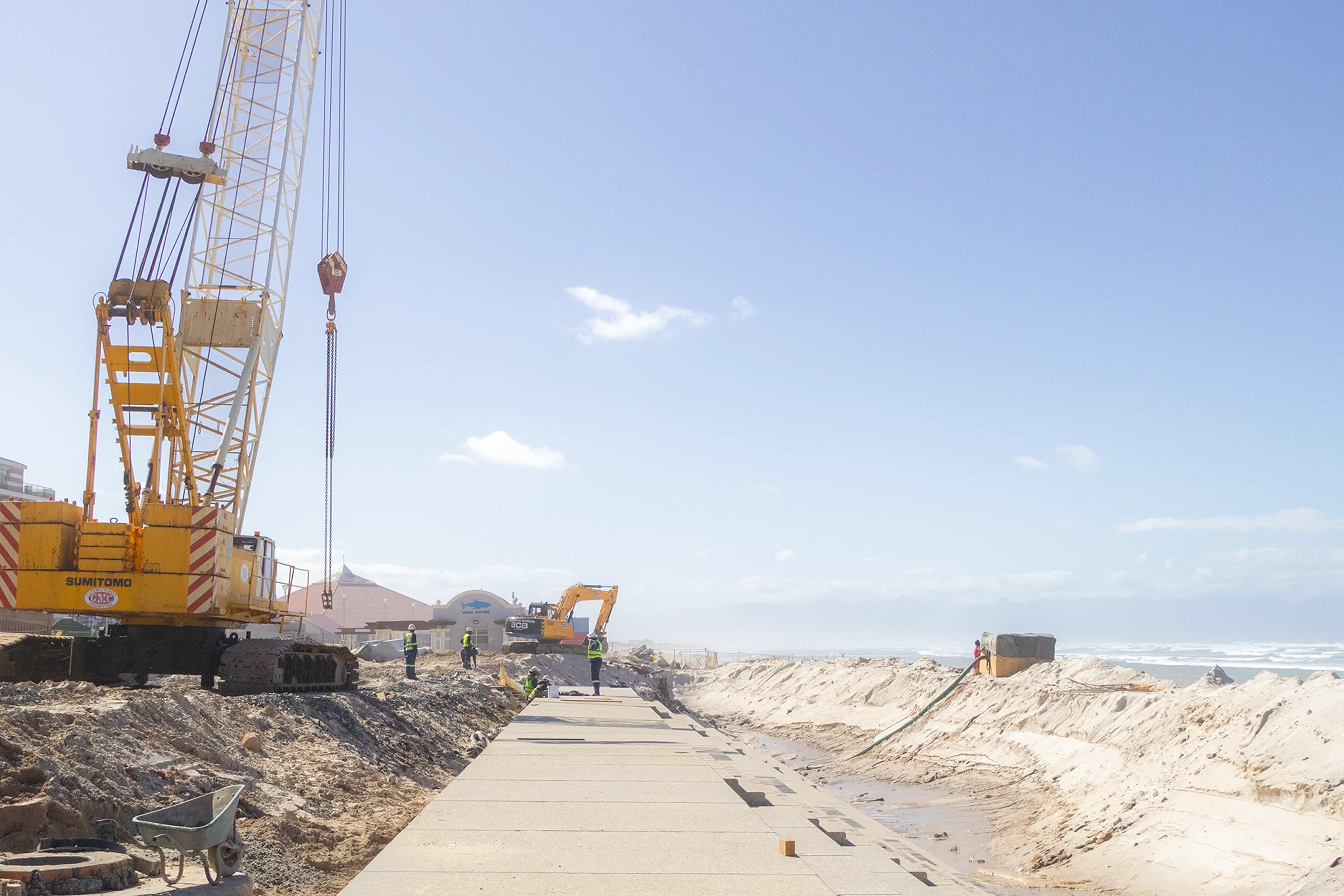Coastal construction site with crane for the GPS clock-in verification article