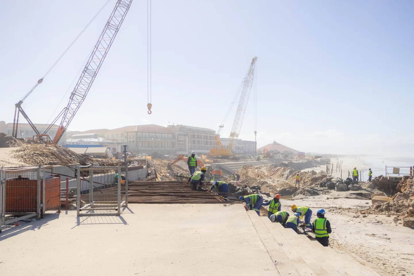 Construction team working on a coastal site.